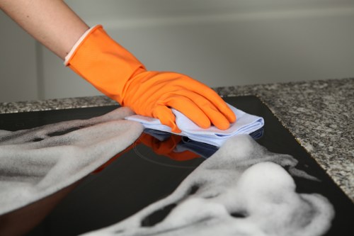 Cleaner following a health and safety policy during routine cleaning