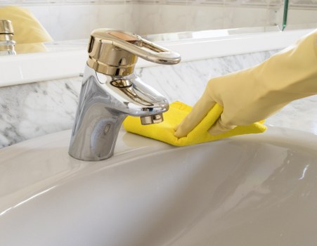 Local hard floor cleaning service treating a stone floor surface